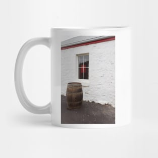 Wine barrel in front of window. Mug